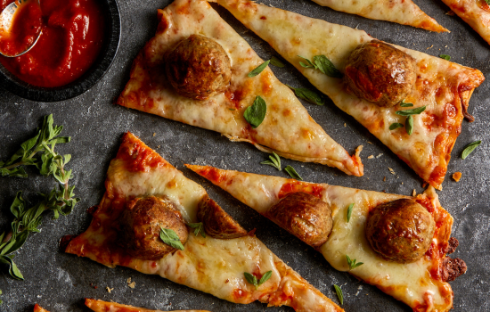 An artful display of Meatball Flatbread slices, reinforcing the hearty toppings a BONICI® crust can handle.